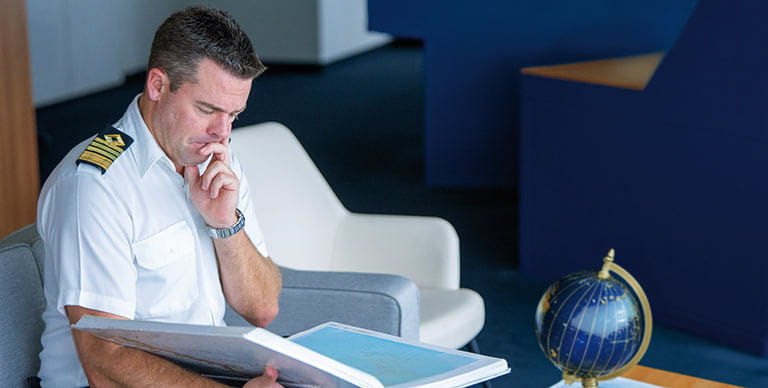 Captain Kim Tanner pondering the itinerary of his Mystery Cruise